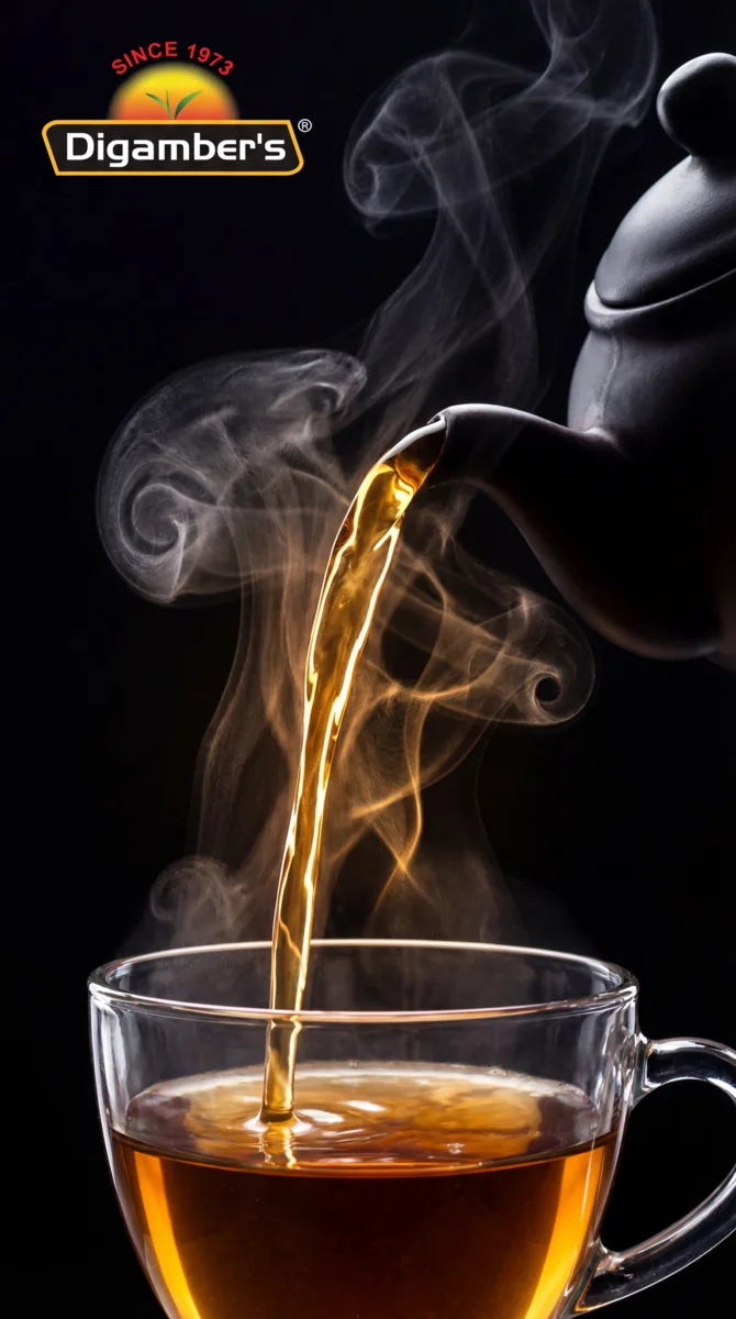 Tea being poured from a teapot into a glass cup with steam, Digamber's logo visible.